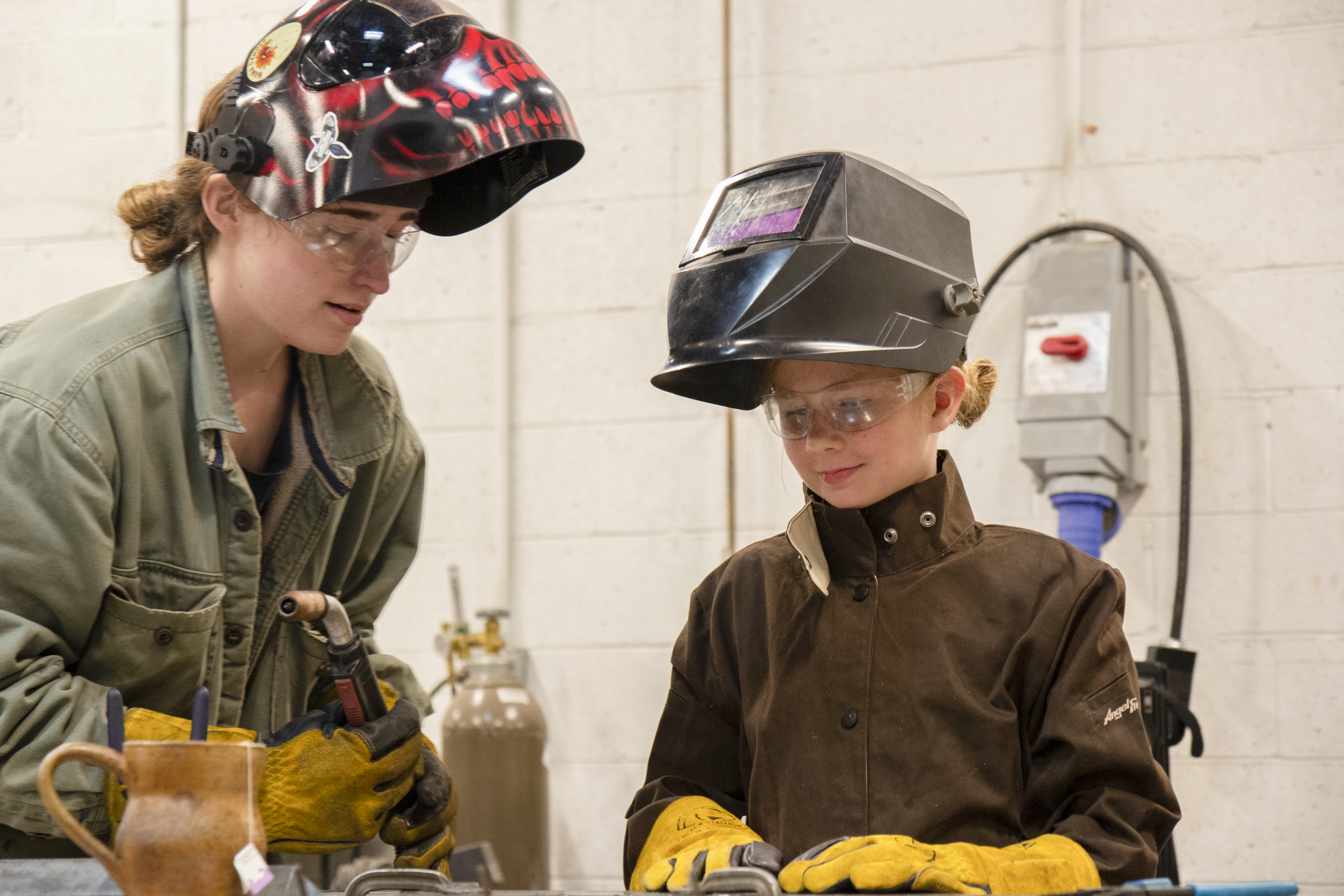 SkillSet Metals Instructor teaches a student how to weld