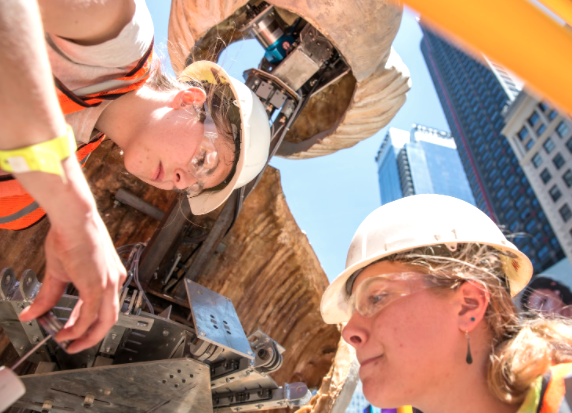 Students work on the robotic part of the Wake sculpture