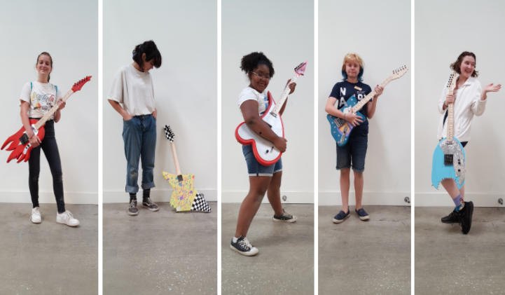 Five students with their custom made guitars